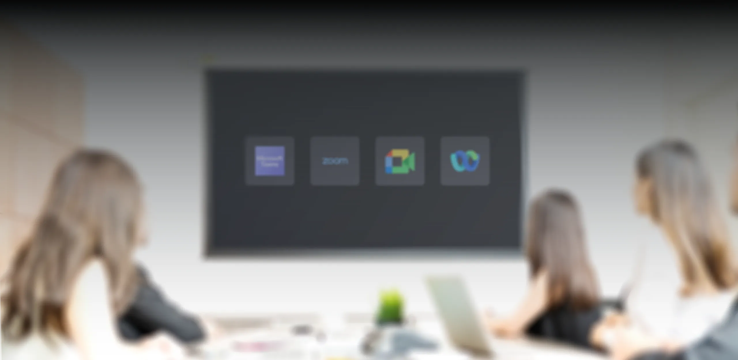 A meeting room display showing the video conferencing platforms Mago joins